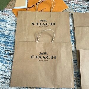 2 medium size coach shopping bags empty